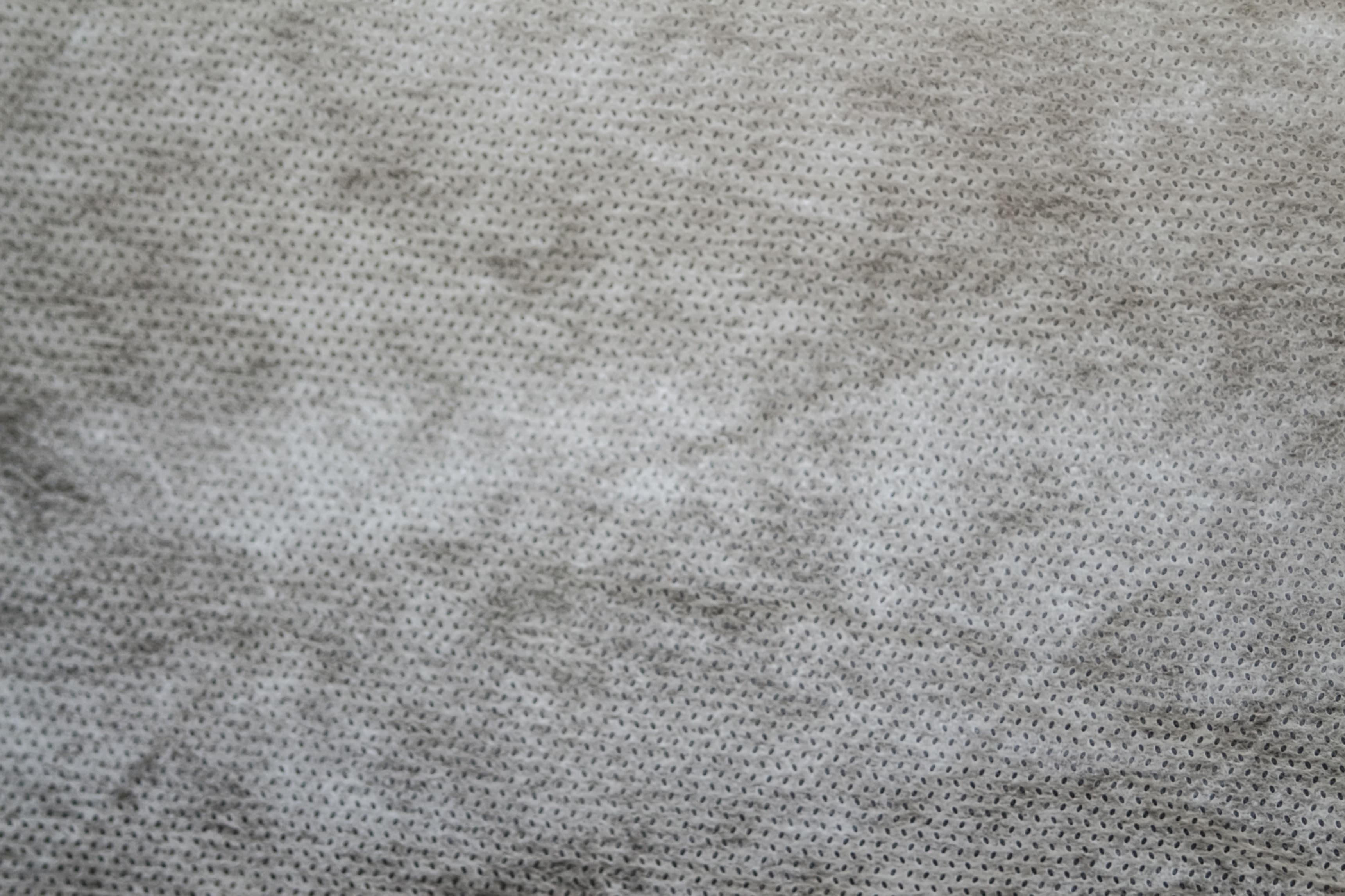 Close-up of grey spunbond non-woven polypropylene geotextile